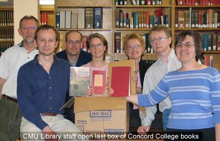 CMU Library staff open last box of Concord College library books