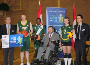 CMU student athletes are joined by Terry Schellenberg (CMU VP, External), the Honourable Steven Fletcher (Minister of State, Transport), and John Unger (CMU VP, Administration & Finance)