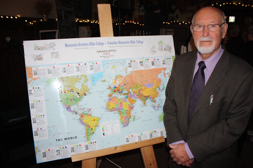 Henry Visch, one of the organizers of the CMBC/MBBC Class of 1953 60-year reunion, stands with a “ministry map” he created. The map indicates where members of the Class of 1953 have worked and served, including Ecuador, Uruguay, Paraguay, Israel, China, and Japan.