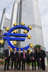 Tour participants stand in front of the Eurotower, home of the European Central Bank in Frankfurt, Germany.