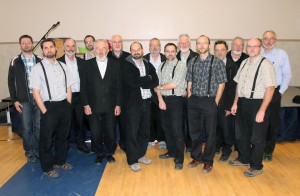 Dr. John J. Friesen, Professor Emeritus of History and Theology at CMU, stands with members of the Hutterian Brethren Education Committee. 