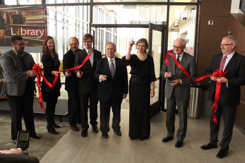 Ribbon-cutting at Marpeck Commons with (l-r) Elton DeSilva, MB Church Manitoba Executive Director;  Marlene Janzen, Marlene Janzen CMU Board of Governors Chair; Jerold Peters, ft3 Principle Architect; Josh Hollins, CMU Student Council President; Elmer Hildebrand, CMU Capital Campaign Chair; Cheryl Pauls, CMU President; Ted Paetkau Concord Projects CEO, Willard Metzger, MC Canada Executive Director