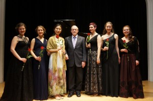Peter Janzen, center, with the six Verna Mae Janzen Music Competition finalists