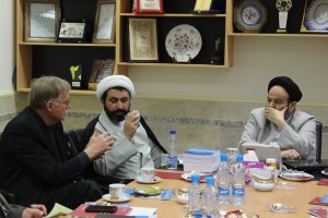 Dr. Harry Huebner of CMU (left) and Dr. Mohammad Ali Shomali of the International Institute for Islamic Studies (middle) speak during a 2014 visit in Qom, Iran.