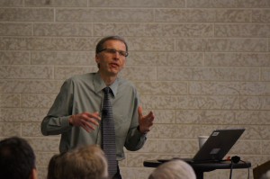 Dr. Janzen addresses the audience at public lecture