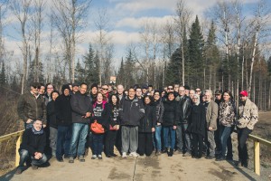 The group poses for a photo on the temporary bridge across the diversion canal. (photo credit: James Christian Imagery)