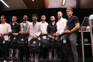 Aquino (far right) accepts his All-Canadian Award at the 2022 CCAA Men's Soccer Nationals