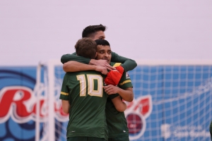 Blazers Men's Futsal players embrace after moving on to the Finals