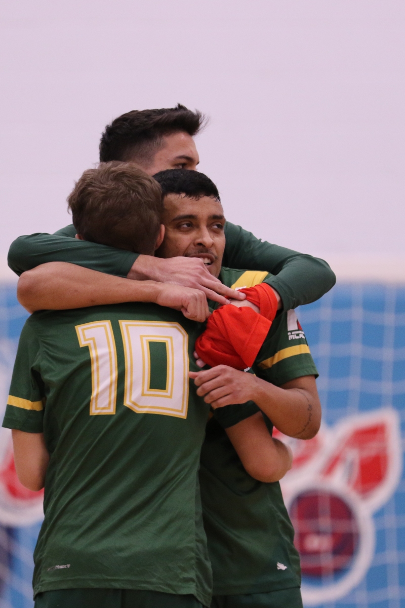 Blazers Men's Futsal players embrace after moving on to the Finals