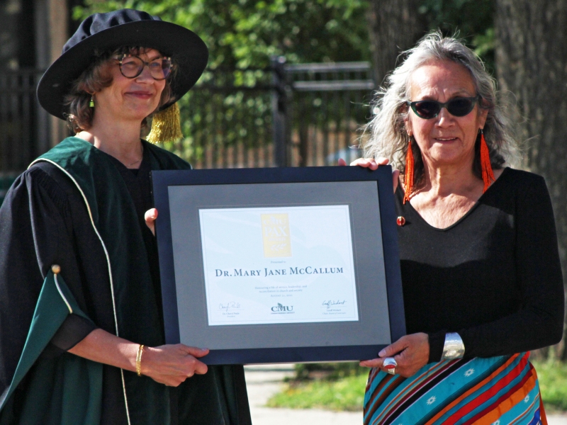 CMU President Dr. Cheryl Pauls (left) presents the 2021 CMU PAX Award to Dr. Mary Jane McCallum