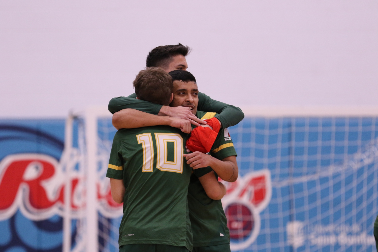 Blazers Men's Futsal players embrace after moving on to the Finals Blazers Men's Futsal players embrace after moving on to the Finals