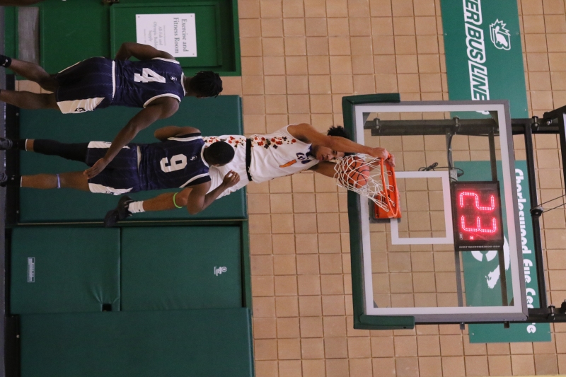CMU's Isaiah Cole throws it down over the visiting Providence Pilots