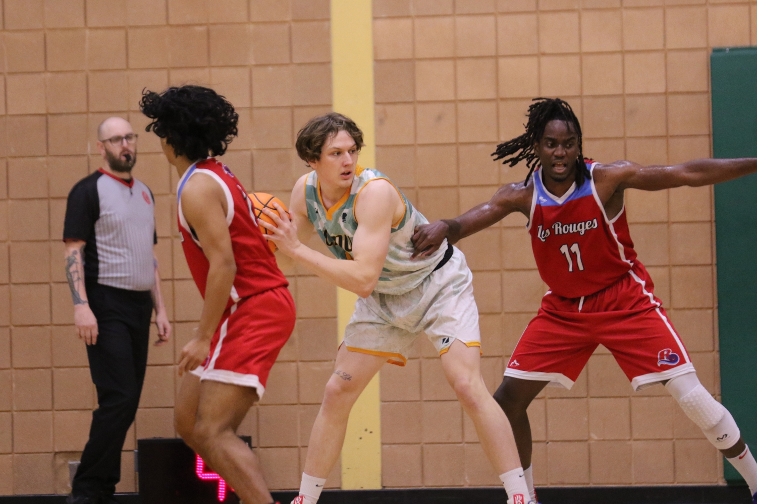 Cameron collects a rebound and looks to score in their MCAC home-opener against Les Rouges Cameron collects a rebound and looks to score in their MCAC home-opener against Les Rouges