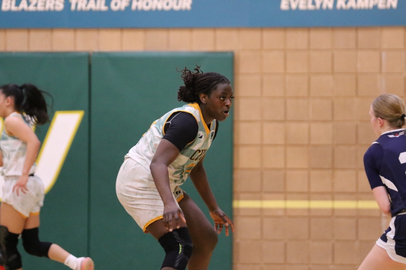 Gbadamosi defends the paint during the 2025 MCAC Championship Final