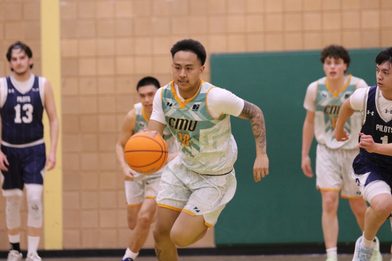Lisan pushes the ball up court during the MCAC Final