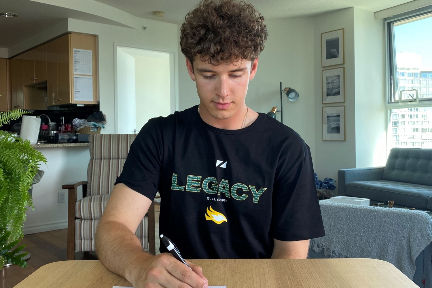 Osmack signs his letter of intent from his Vancouver home Osmack signs his letter of intent from his Vancouver home