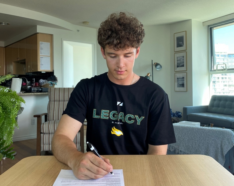 Osmack signs his letter of intent from his Vancouver home