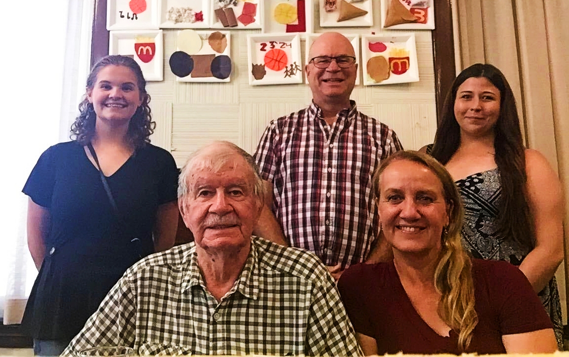 (Back row, L-R) Hannah Connelly, Neil Weisensel, and Bryna Link meet with translator Jules Chartrand (front-left) and his daughter Yvonne Chartrand (front-right).