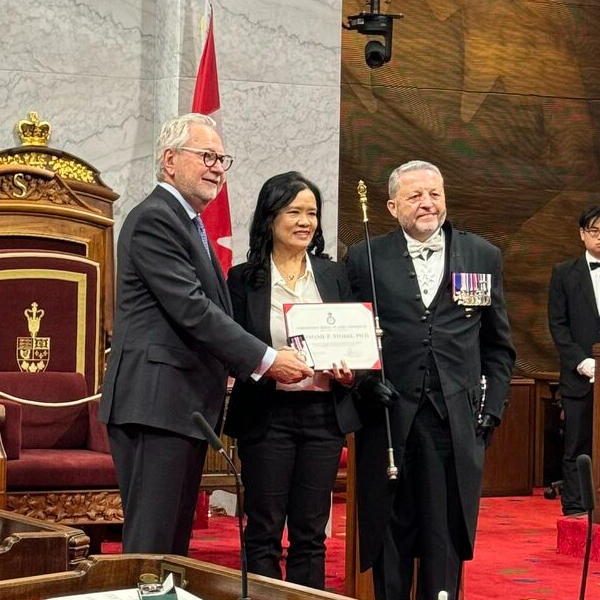 Dr. Stephanie Stobbe receives King Charles III’s Coronation Medal in recognition of her work as part of the Hearts of Freedom project, a travelling exhibition that moved throughout various cities in the country, telling the stories of Southeast Asian refugees.