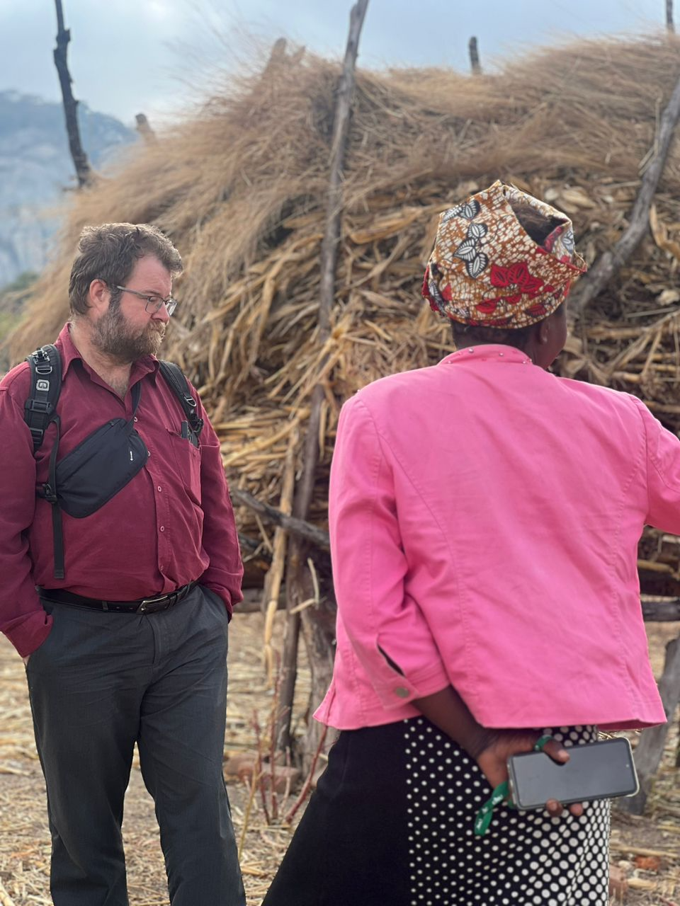 Jonathan M. Sears, PhD. Associate Professor of International Development and Political Studies, engages in conversation with a local community member in Zimbabwe.