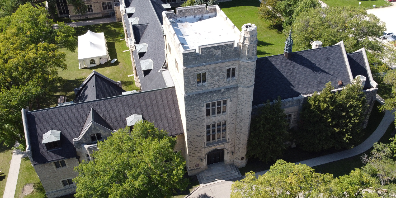 North side aerial view of beige stone building at Canadian Mennonite University
