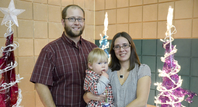 Steve and Stephanie Penner with their son, Teddy. The couple wed a few months after graduating together in 2004.