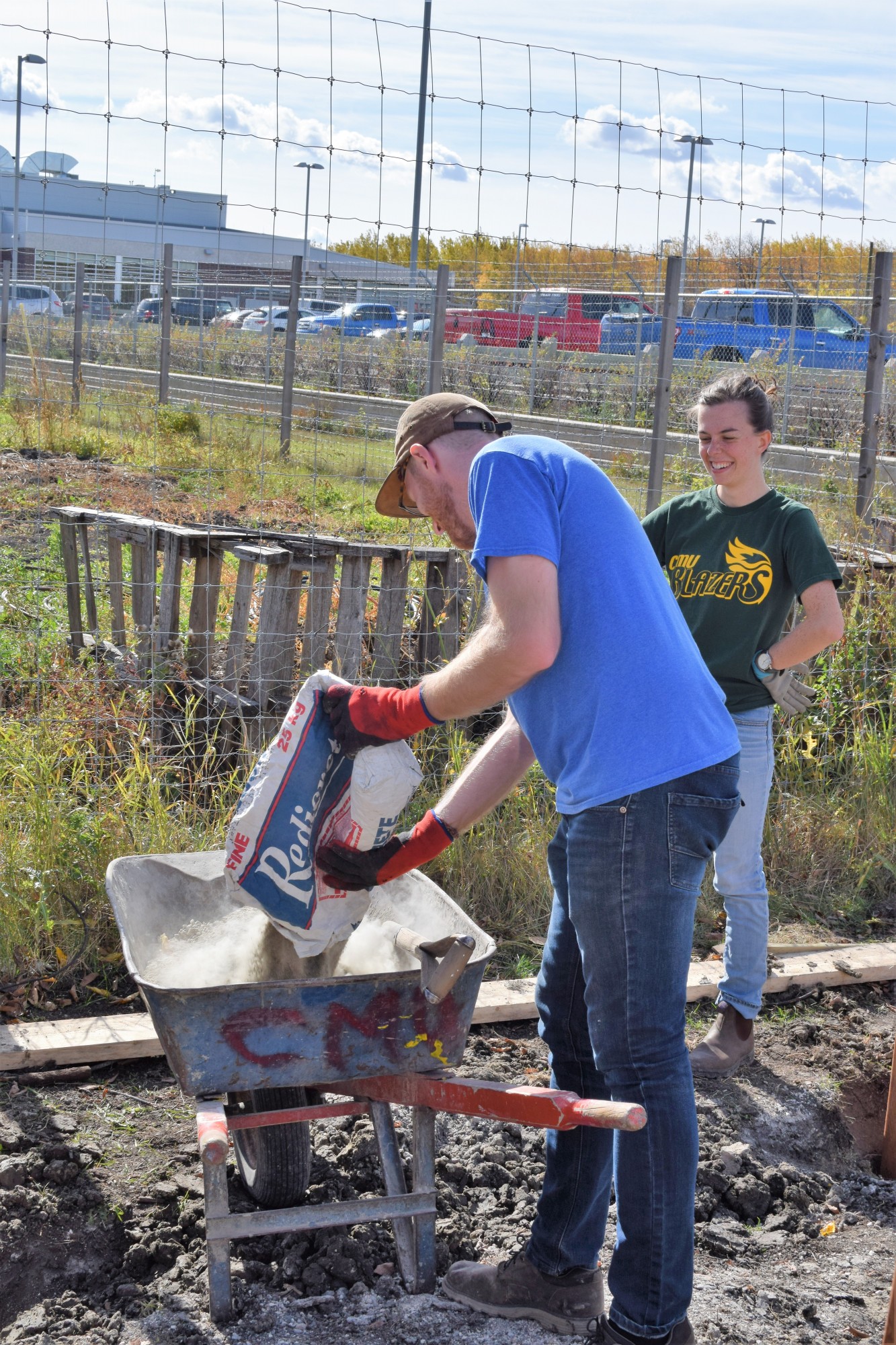 Students building CMU's compost bin