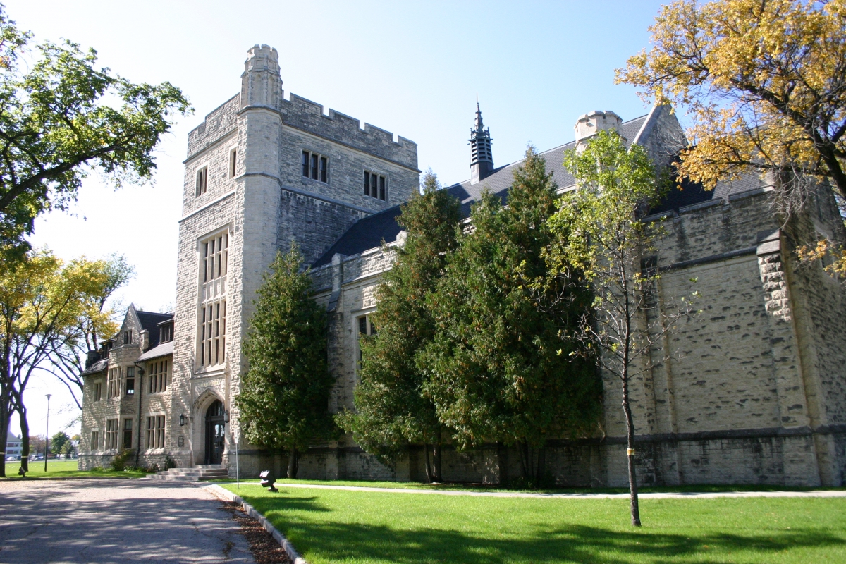 North side view of beige stone building at Canadian Mennonite University