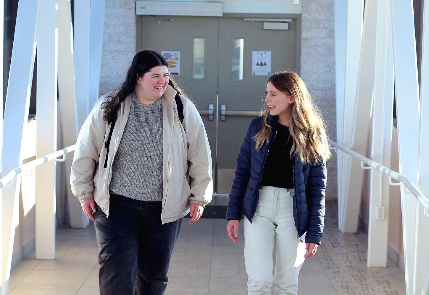 students walking together across the skywalk
