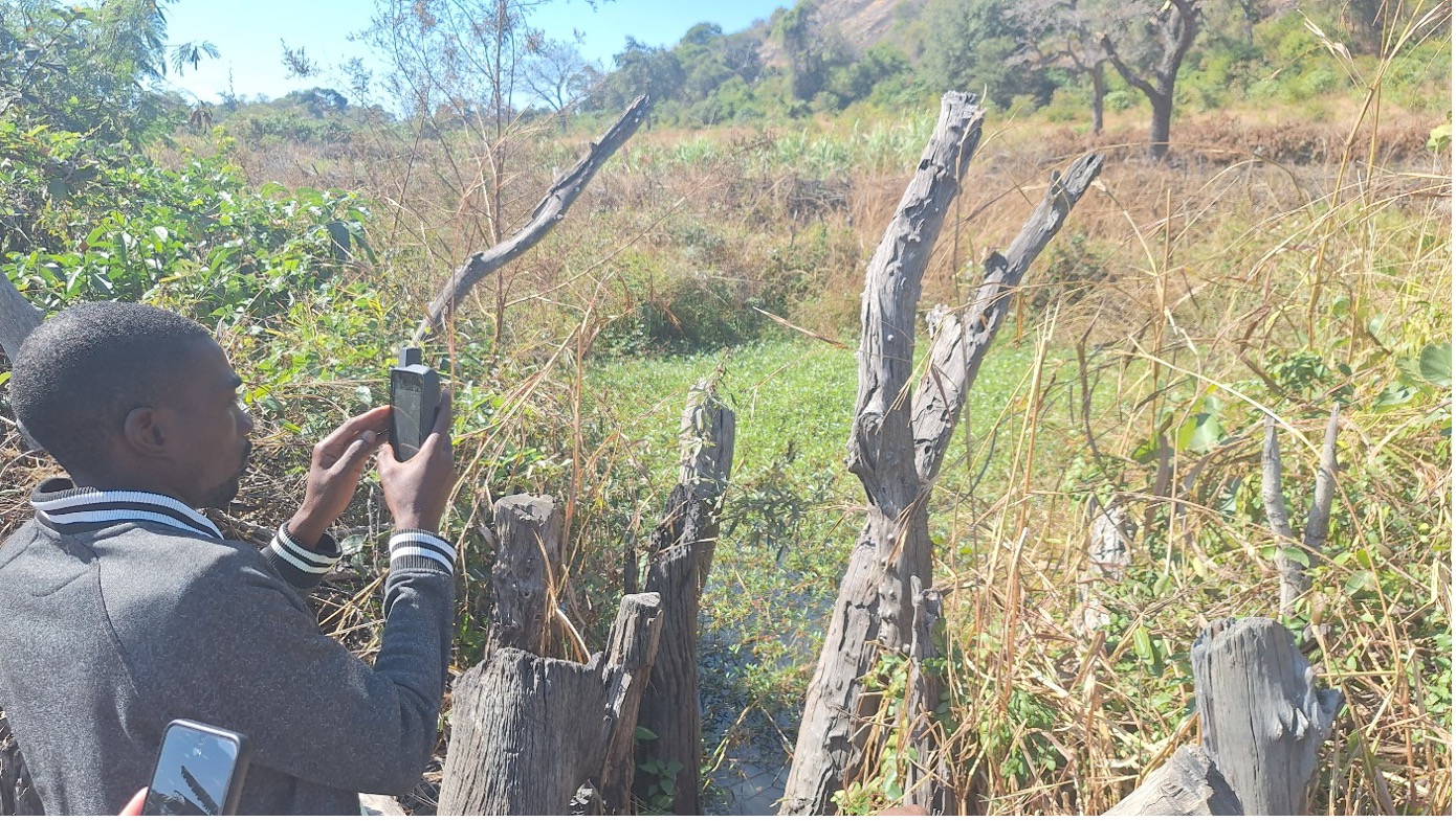 Score Against Poverty Community Biodiversity Lead, Ashton Mahachi, records a GPS point in the Chinyevenyeve wetland that will be protected and preserved under the LINCZ project in Mwenezi. 