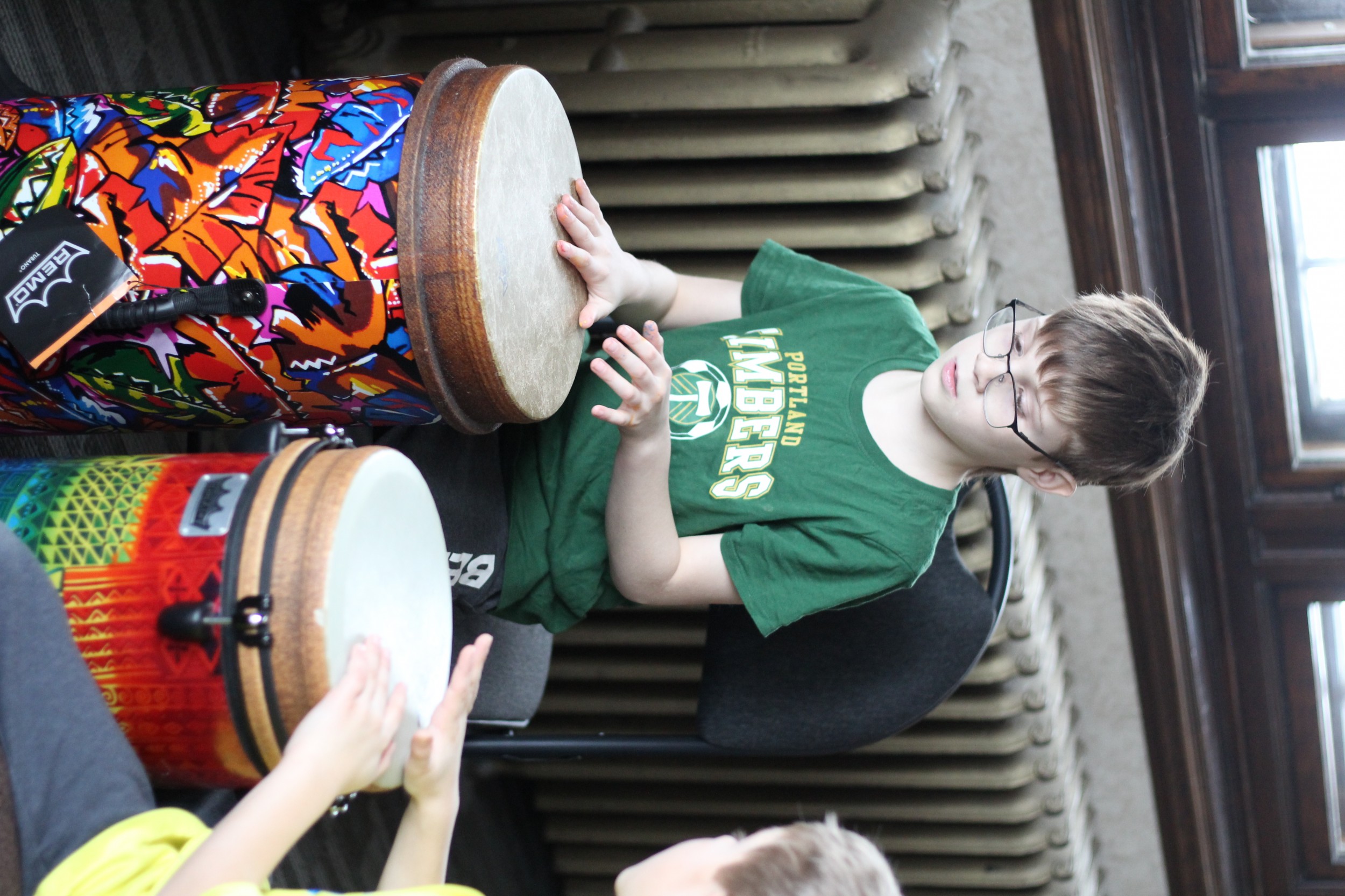Students play drums